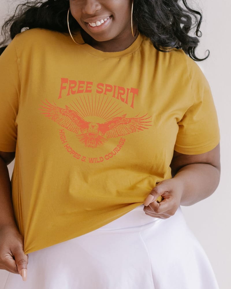 Front of a model wearing a size Large Free Spirit Distressed Eagle in Mustard by Simply Sage Market. | dia_product_style_image_id:281483
